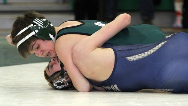 NJSIAA District 12 wrestling tournament held at South Plainfield High School in South Plainfield on Friday February 20, 2015.  South Plainfield High School's Joe Heilmann (top) battles Matthew Sternesky of Colonia High School during the 106 lb. bout.