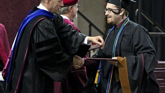 In this file photo, a graduating MSU Texas student shakes hands with Dr. Matthew Capps, left. Capps, Dean of the West College, said accreditation of the MA in Clinical Counseling program is an important achievement.
