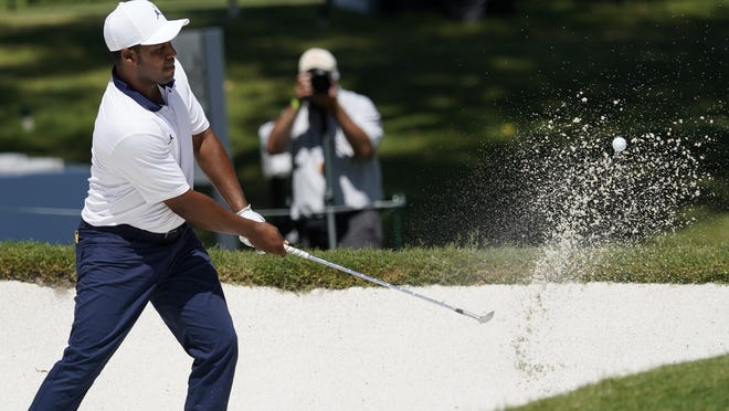 Harold Varner III hits out of the sand at the eighth green during the second round of the Charles Schwab Challenge golf tournament at the Colonial Country Club in Fort Worth, Texas, Friday.