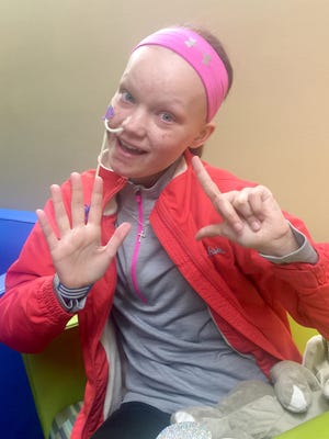 A fundraiser for 12-year-old Taylor Budysz, pictured here facing her seventh round of chemotherapy, is set for Saturday, July 16, at The Chadderbox in Two Rivers.