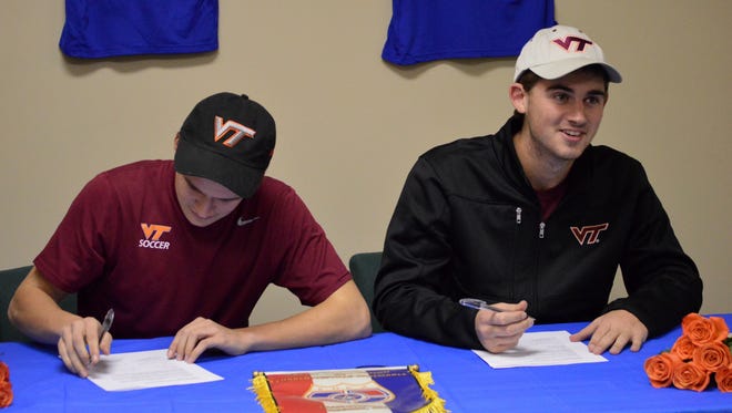 James Kasak (left) and Burke Bender (right), sign their national letters of intent on Wednesday, February 3. Both Kasak and Bender will be joining the Virginia Tech mens soccer team.