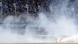 Kyle Larson performs a burnout after winning the NASCAR