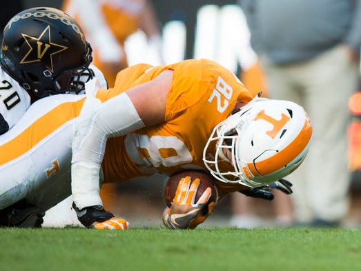 Tennessee tight end Ethan Wolf (82) is tackled by Vanderbilt