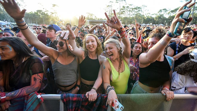 Flags and banners swayed as beats filled the air Saturday, Mar. 3, 2018, during the third day of the Okeechobee Music and Arts Festival at Sunshine Grove in Okeechobee. The festival, which continues through Sunday, features a wide array of local, national, and international musicians and artists. 