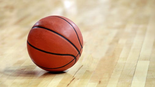 Basketball on Hardwood Floor