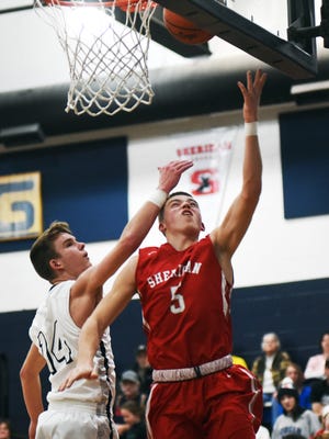 Dylan Emmert goes up for a layup during the second quarter of Sheridan's 87-54 win against Morgan on Tuesday night in McConnelsville. Emmert scored eight points in a 23-3 run that broke the game open.