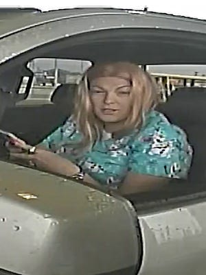 A woman is caught on video cashing fraudulent checks in Clarksville.