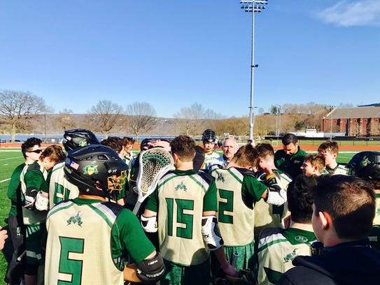 St. Joseph lacrosse coach Dale Weingarten talks to