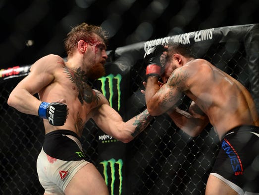 McGregor lands a hard left hand against Mendes at UFC