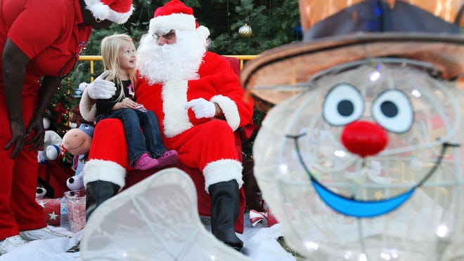 Liliana Messman, 3, was among the kids who got a chance to meet Santa during the "Christmas in the Park" event Saturday at Centennial Park in downtown Fort Myers. The event was sponsored by the Fort Myers Department of Recreation Division.