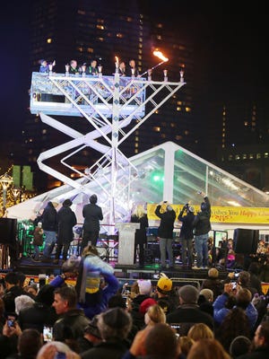 Hundreds of people  gather for the Fifth Annual Lighting of the Menorah in Cadillac Square in Downtown Detroit Sunday, Dec. 6, 2015. 