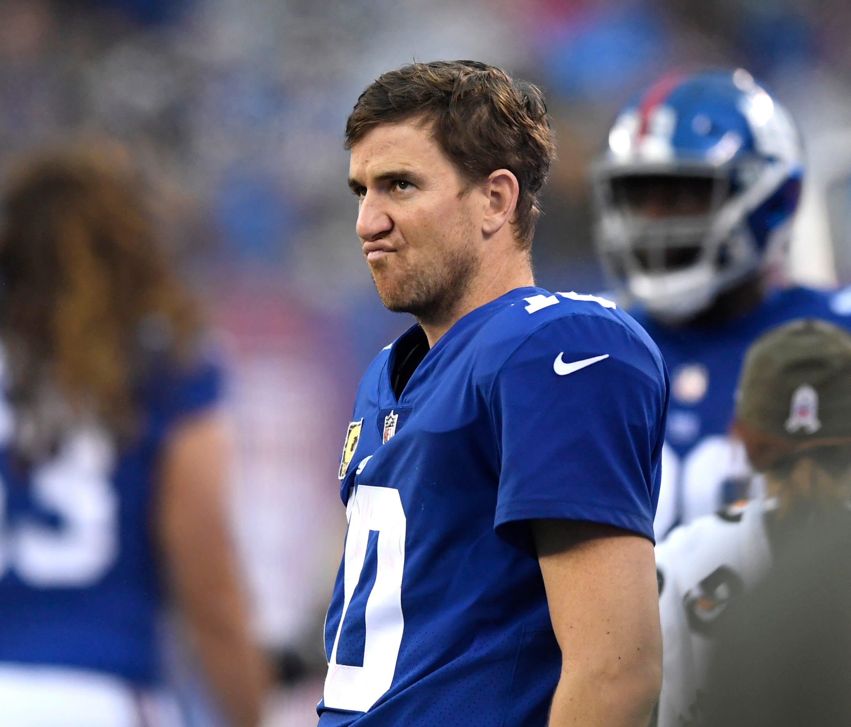 New York Giants quarterback Eli Manning (10) watches from the sideline as the Los Angeles Rams defeat the Giants 51-17 at MetLife Stadium.