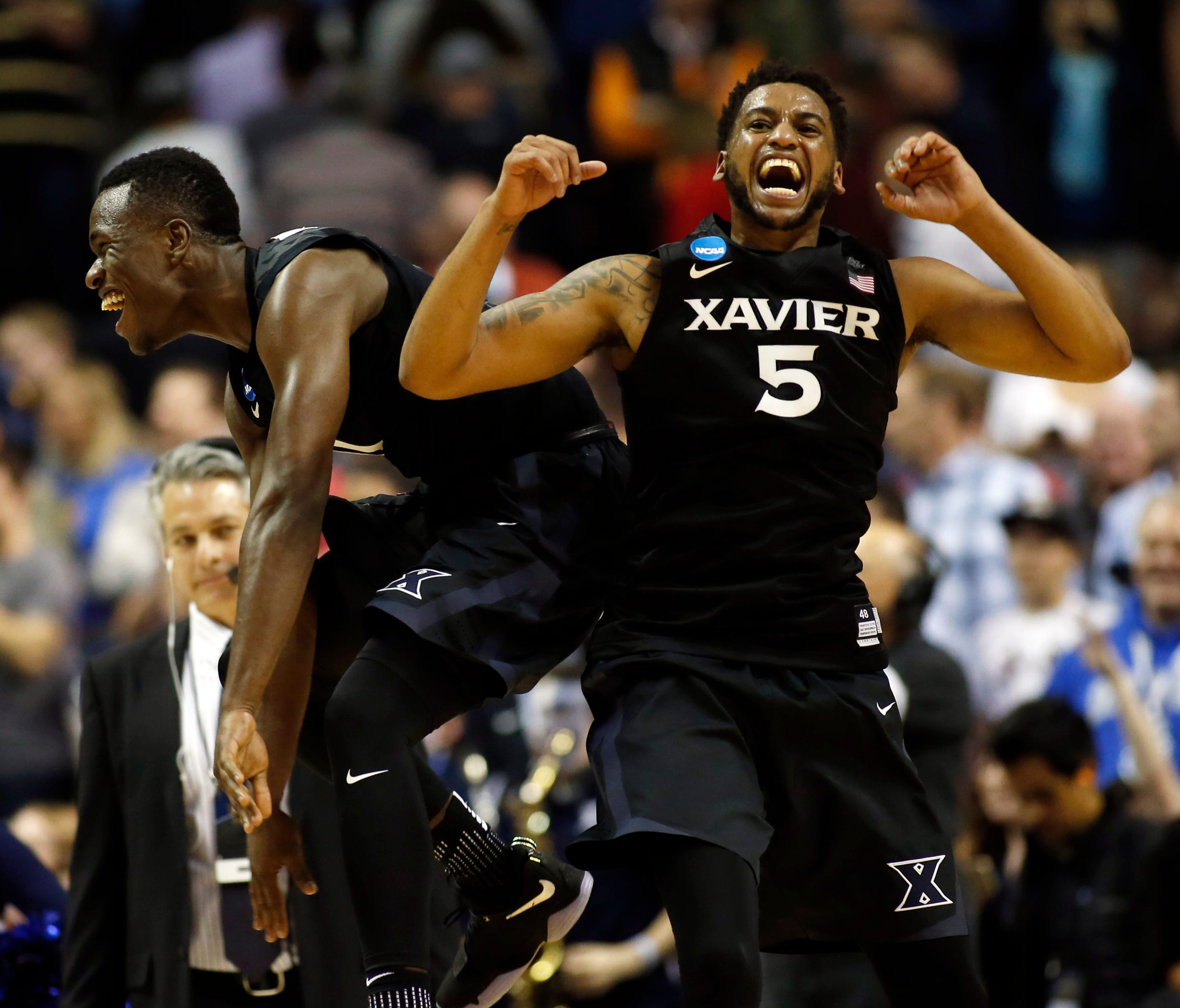 Xavier Musketeers guard Malcolm Bernard (left) and guard Trevon Bluiett (5) celebrate after defeating the Arizona Wildcats during the semifinals of the West Regional of the 2017 NCAA Tournament at SAP Center.