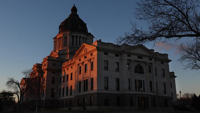 The setting sun paints the front side of the South Dakota State Capitol in Pierre on Tuesday, Feb. 23, 2016.