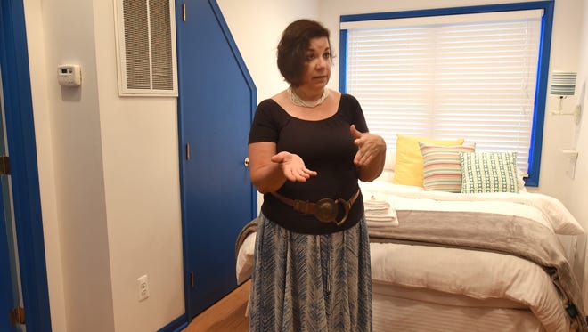 Michele Bierzynsk talks about renting out the Birmingham carriage house she manages as an Airbnb property. The second-floor room, with bathroom, TV, WiFi and coffee and cold breakfast provided, usually rents for about $60 a night.