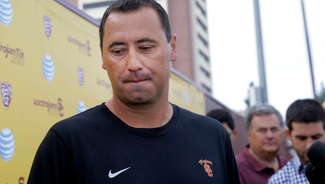 Southern California NCAA college football coach Steve Sarkisian speaks to media before football practice, in Los Angeles, Tuesday, Aug. 25, 2015. Sarkisian publicly apologized for his drunken appearance at a team rally last weekend, attributing his slurred, profane speech to a combination of alcohol and medication.(AP Photo/Nick Ut)
