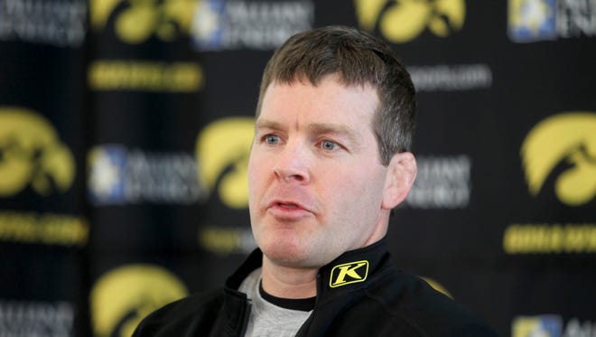 Iowa head coach Tom Brands talks with the media during Iowa wrestling media day at the Iowa wrestling room on Thursday, November  7, 2013.
