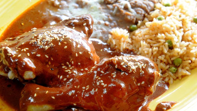 A chicken mole plate is served at El Capricho Restaurant in Santa Paula.