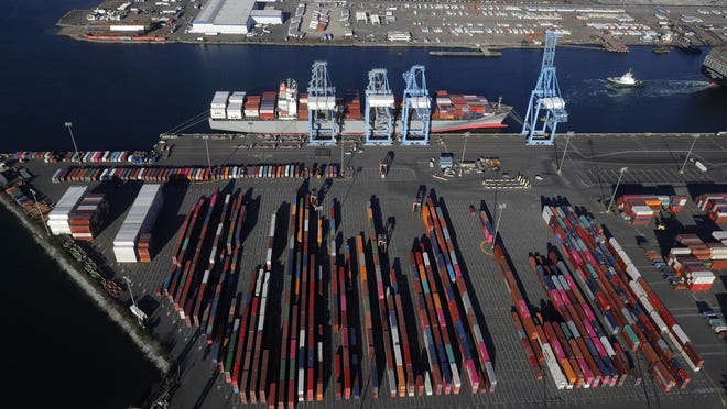 FILE - In this March 5, 2019, file photo, cargo containers are staged near cranes at the Port of Tacoma, in Tacoma, Wash. Most economists were already worried that the odds of a recession are rising, and most of the worries stem from the U.S.-China trade war. (AP Photo/Ted S. Warren)