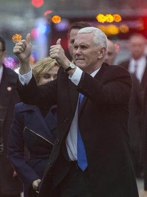 Vice President Mike Pence gives two thumbs up to the crowds Jan. 20, 2017, while walking in the Inaugural Parade.
