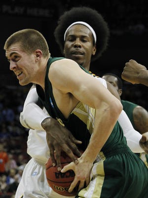 Murray State forward Edward Daniel, rear, commits a foul on Colorado State forward Pierce Hornung (4) in the first half of an NCAA tournament second-round college basketball game in Louisville, Ky., Thursday, March 15, 2012.