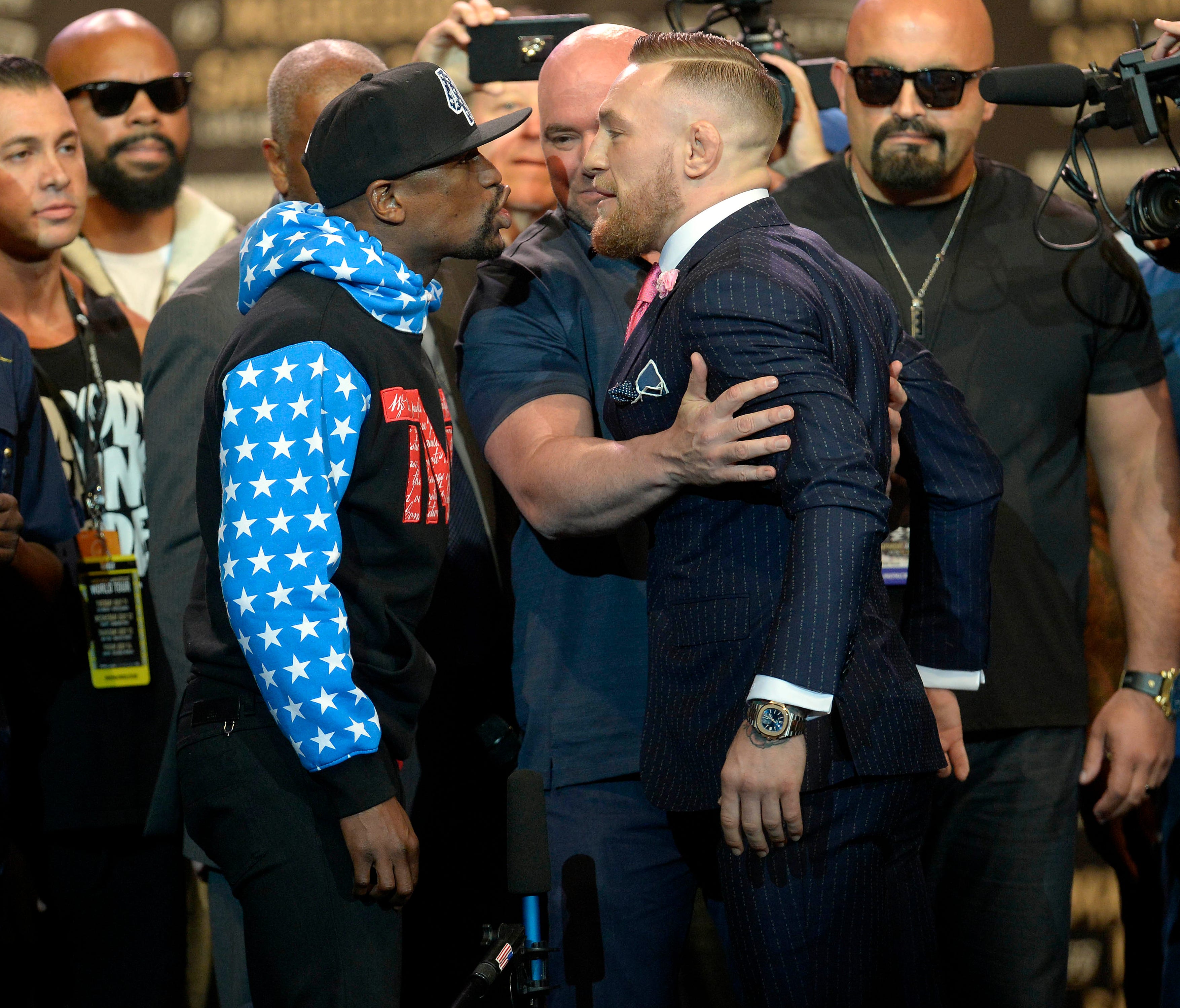 Floyd Mayweather, left, and Conor McGregor will meet in the ring on Aug. 26 in Las Vegas.