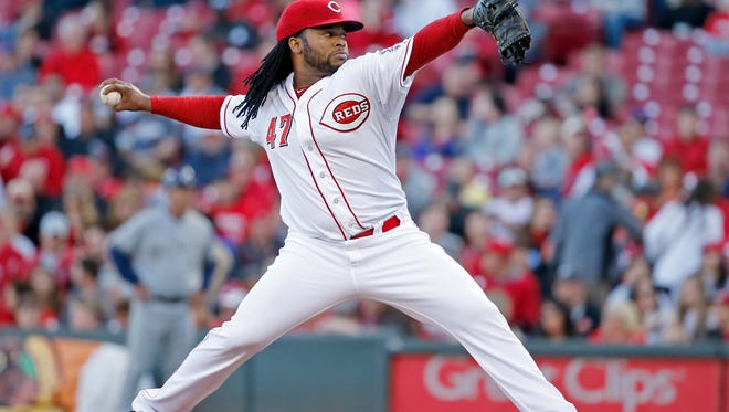 Reds starting pitcher Johnny Cueto delivers to the plate in the second inning Tuesday against the Brewers.