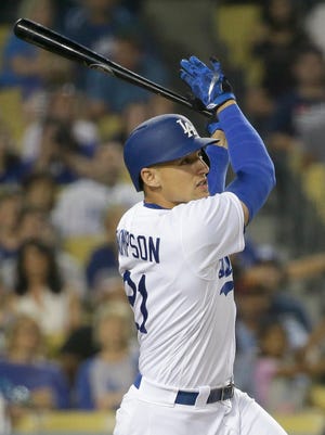 Los Angeles Dodgers' Trayce Thompson watches his home run against the Atlanta Braves during the fifth inning of a baseball game in Los Angeles, Friday, June 3, 2016. (AP Photo/Chris Carlson)