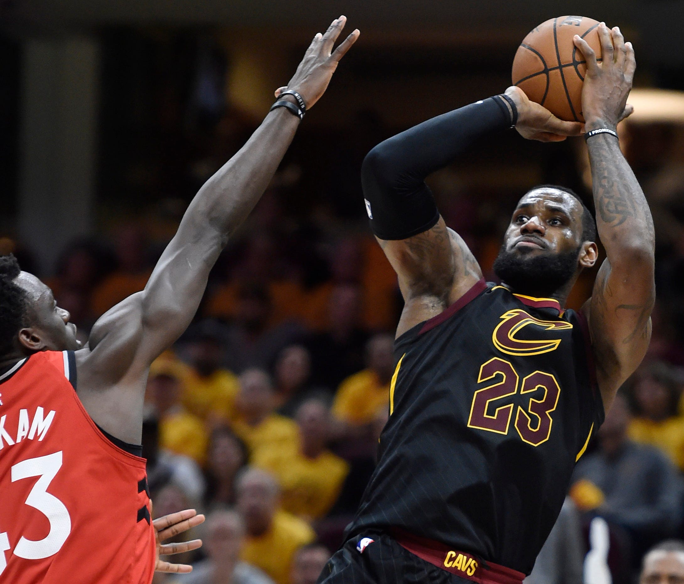 LeBron James makes a fadeaway shot over Raptors forward Pascal Siakam in the NBA playoffs.
