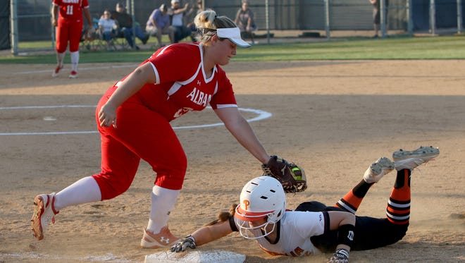 Petrolia's Kelsie Whalen slides back to first to avoid the pick-off attempt from Albany's Kaley Smith Thursday, May 24, 2018, in Graham. Albany defeated Petrolia 5-3.