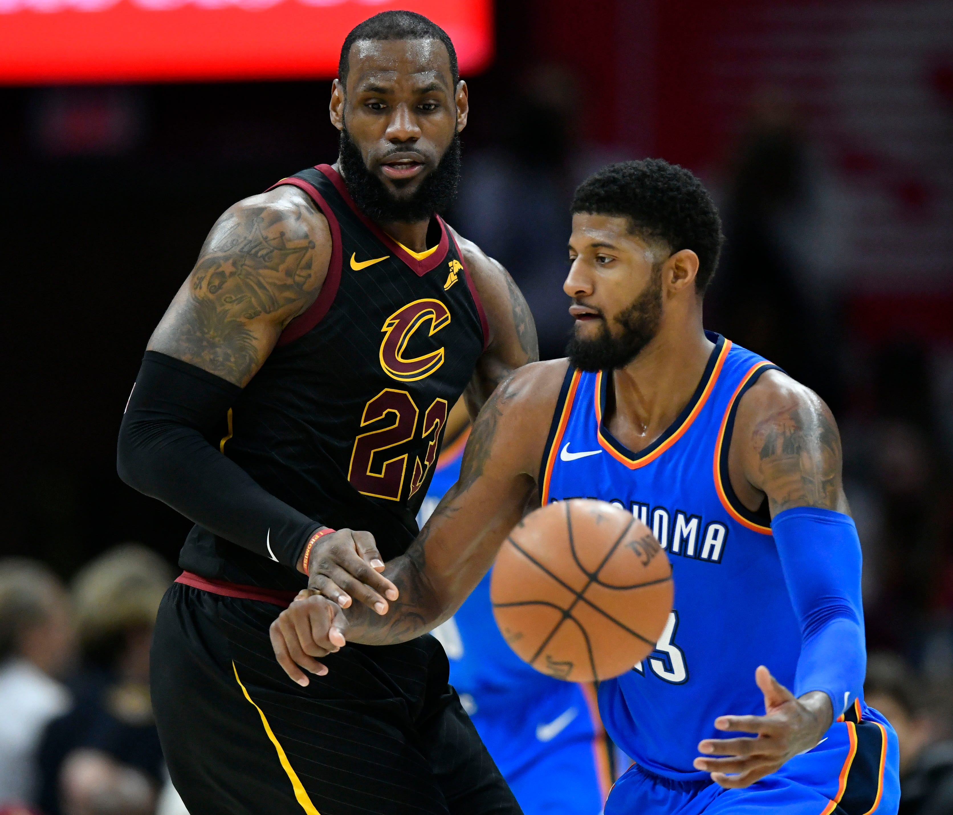Cleveland Cavaliers forward LeBron James (23) defends Oklahoma City Thunder forward Paul George (13) in the third quarter at Quicken Loans Arena.