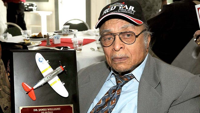 Tuskegee Airman Dr. James B. Williams, 93, shows a plaque he received Saturday at a Veterans Appreciation Luncheon hosted by the Doa Ana County Branch of the NAACP at the Alameda House.