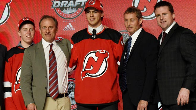 Nico Hischier poses for photos after being selected as the number one overall pick to the New Jersey Devils in the first round of the 2017 NHL Draft at United Center on Friday, June 23, 2017.