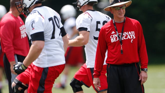 University of Cincinnati head coach Tommy Tuberville watches his team work out during practice in August.