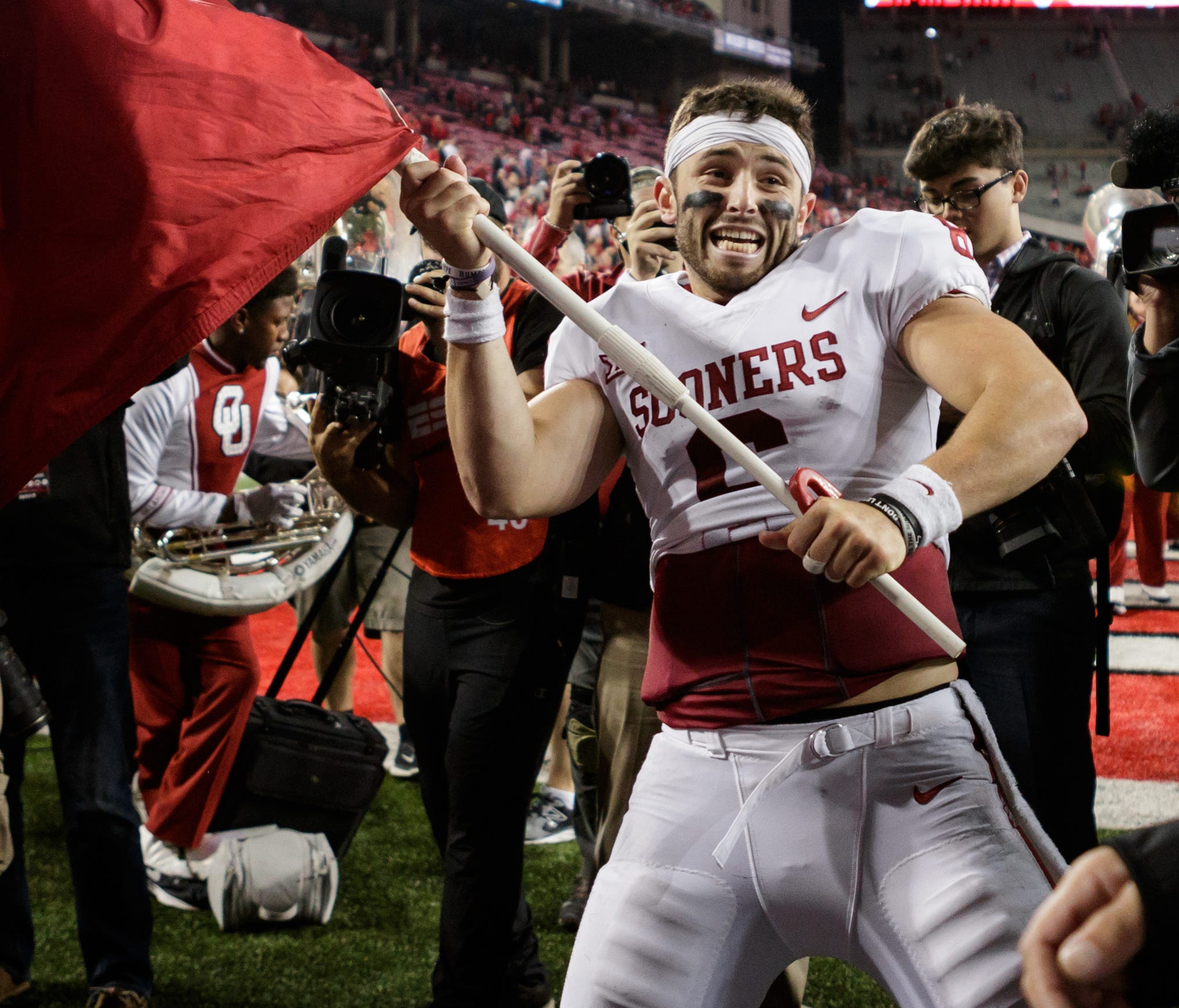 September 9th, 2017: Oklahoma Sooners quarterback Baker Mayfield (6) waves the OU flag on the field after a NCAA football game between the Ohio State Buckeyes and the Oklahoma Sooners at Ohio Stadium, Columbus, OH. Oklahoma defeated Ohio State 31-16.