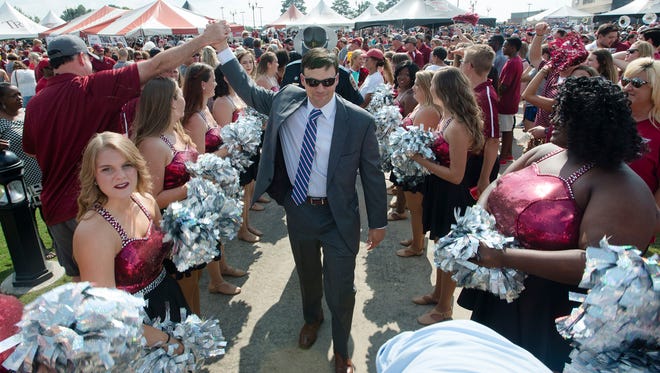 Troy head coach Neal Brown greets fans during Trojan Walk before NCAA football game between Troy and Akron on Saturday, Sept. 23, 2017, in Troy, Ala.