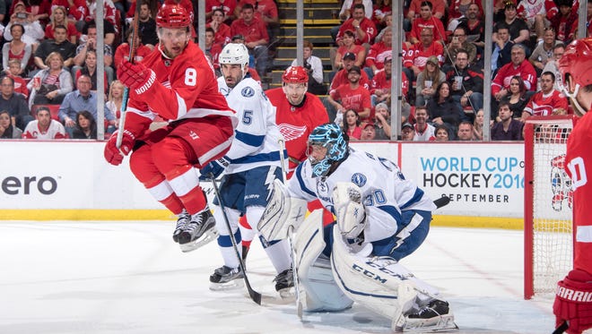 Detroit left wing Justin Abdelkader tries to deflect the puck past Tampa Bay goalie Ben Bishop in the first period.
