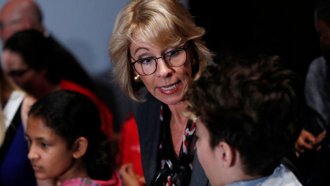 Education Secretary Betsy DeVos talks to students at the Smithsonian's National Air and Space Museum in Washington, Tuesday, March 28, 2017, during an event to celebrate Women's History Month.