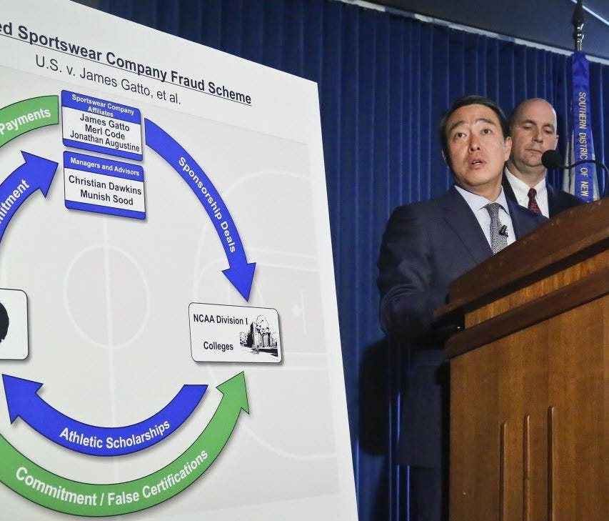Acting U.S. Attorney for the Southern District of New York Joon H. Kim, second from right, and FBI Assistant Director William Sweeney, Jr., right, hold a press conference to announce the arrest of four assistant basketball coaches from Arizona, Aubur
