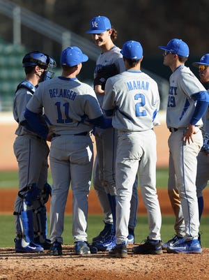 UK pitching coach Jim Belanger meets with starter Sean Hjelle and the Wildcats infield during a mound visit.