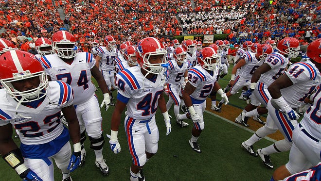 Louisiana Tech players run out on the field last weekend at Auburn.