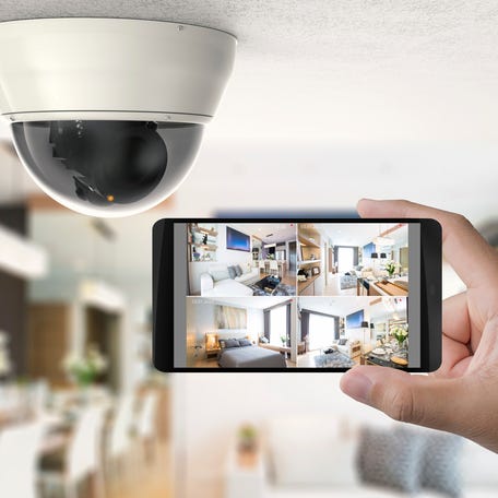 A smart home security camera system pictured inside a house.