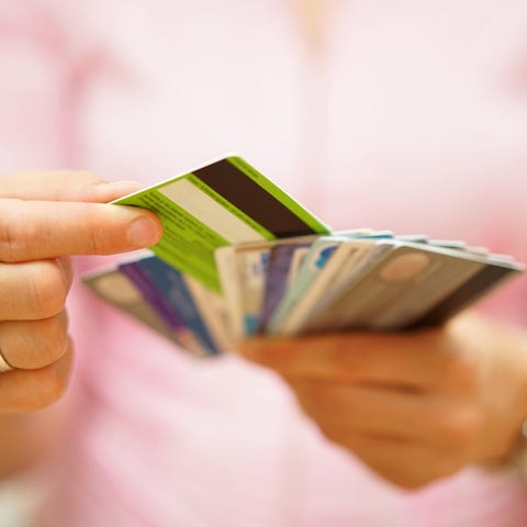 Woman holding multiple credit cards