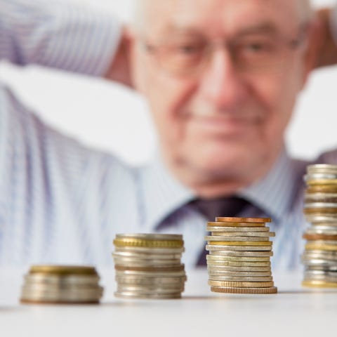 Successful retiree counting his money.