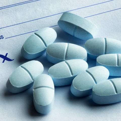 Pills on top of a prescription pad