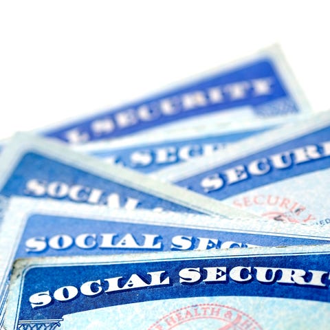 Social Security cards stacked on top of each other