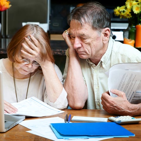 senior couple working on their budget
