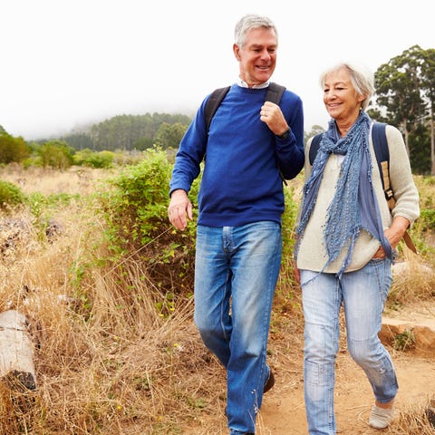 Older man and woman walking outdoors