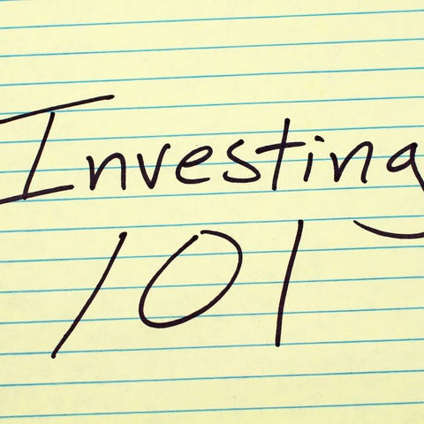 Investing 101 written on a yellow legal pad
