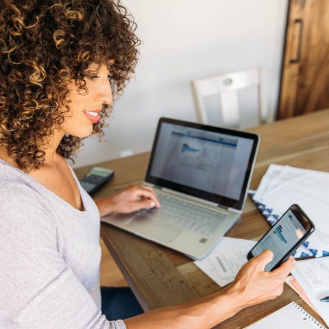 Younger woman checking her retirement investments 